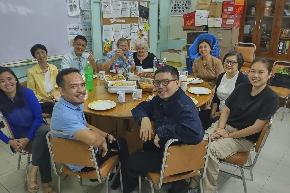 The EPHOD team with Herb and Karen Johnson around a table at Binondo Full Gospel Church, Manila